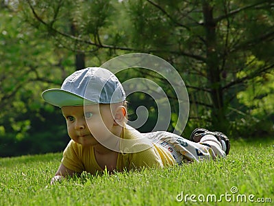 Little baby-boy on the grass Stock Photo