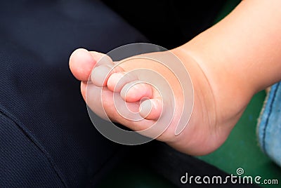 Little baby feet with fingers. Newborn child bare foot. Baby shower photo background Stock Photo