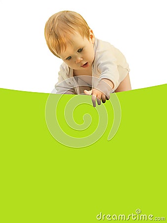 Little baby girl baby curiously bent over the colored sheet. Stock Photo