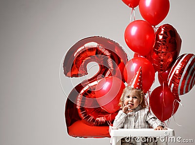 Little baby girl celebrate her second birthday with sweet cake o Stock Photo