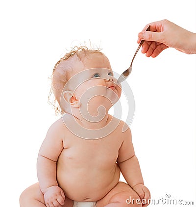Little baby-girl spoon and parent's hand Stock Photo