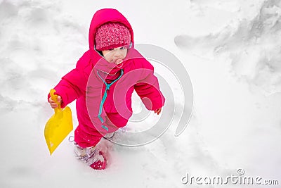 Little baby girl view play snow wearpink child ski suit winter Stock Photo