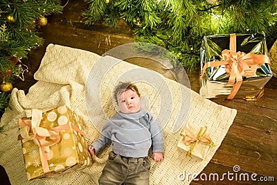 Little baby and new year. Children`s first Christmas. Beautiful little child celebrates Christmas. New Year holidays. A child wit Stock Photo