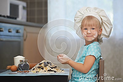 Little baker at work place Stock Photo