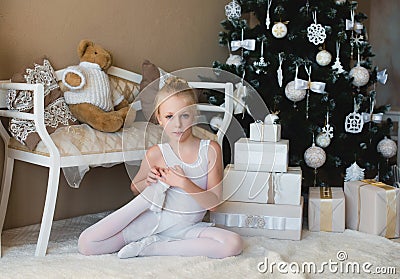 Little ballet dancer doing stretching before exercise Stock Photo