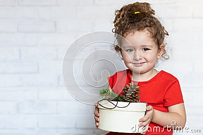 hapy child with gift for new year in eco friendly house Stock Photo