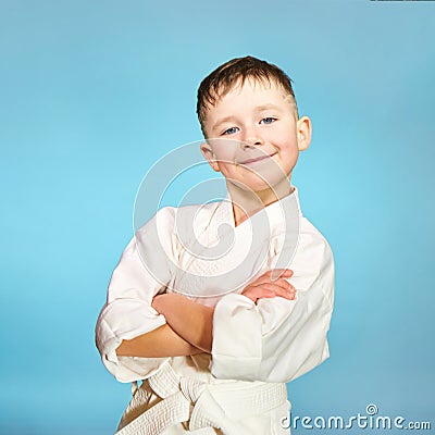 Little beautiful sportsman on a light blue background Stock Photo