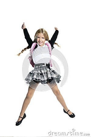 Little beautiful student girl jumping Stock Photo