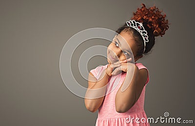 Little black girl dreaming, wearing tiara Stock Photo