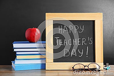 Little blackboard with inscription HAPPY TEACHER`S DAY Stock Photo