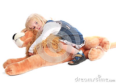 Little blond girl with her toy friend Stock Photo