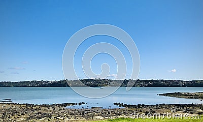 Little boat at sea, with coast and sky landscape. Stock Photo