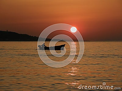 Little boat in summer sunset Stock Photo