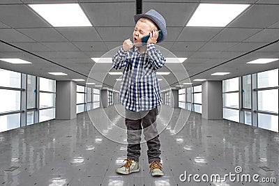 Little boss talks on his mobile phone.Emotional conversation.A great bargain at the Mall. Stock Photo