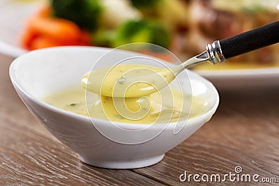 Little Bowl of Bearnaise Sauce. High quality photo. Stock Photo