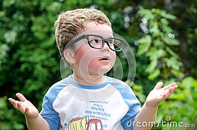 Little boy asks why Stock Photo