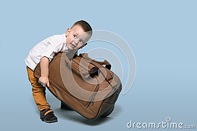 Little Boy Bear a Large Bag. Stock Photo