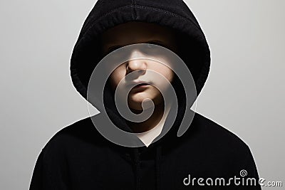 Little boy in black hoodie. Close-up portrait of teenager boy Stock Photo