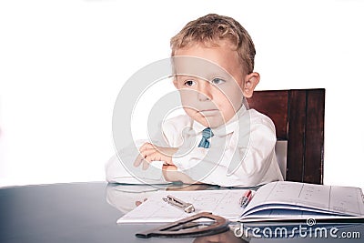 Little boy in a business suit all the cases decided Stock Photo