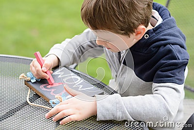 Little boy child drawing a love declaration Stock Photo