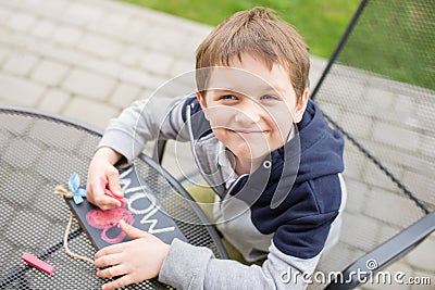 Little boy child drawing a love declaration Stock Photo