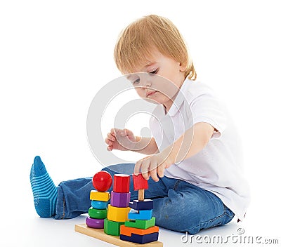 Little boy in the classroom at Montessori environment. Stock Photo