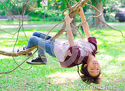 Little boy climb on a tree robe Stock Photo