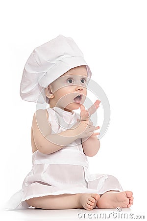 Little boy with cook hat . Baby wearing a chef hat. Use it for child, healthy food concept Stock Photo