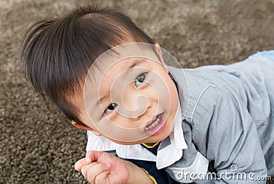 Little boy creep on carpet Stock Photo