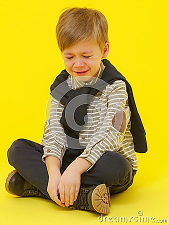 The little boy cries with tears. Stock Photo