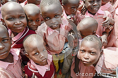 Little boy crowded between students, Uganda Editorial Stock Photo