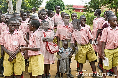 Students in Uganda, school boys and girls of Ugandan school. One school boy comes with little brother. Editorial Stock Photo