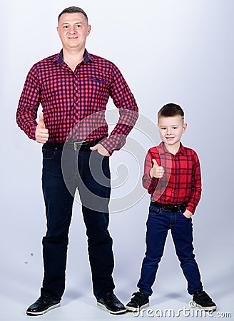 Little boy with dad man. fathers day. happy family. childhood. parenting. father and son in red checkered shirt. Country Stock Photo