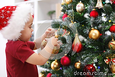 Little boy decorating Christmas tree Stock Photo