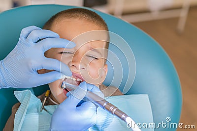 A little boy at a dentist's reception in a dental clinic. Children's dentistry, Pediatric Dentistry. A female stomatologist is Stock Photo