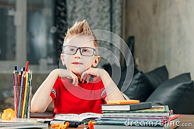 Little boy doing homework in school. Stock Photo