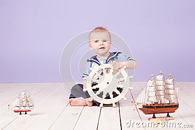 A little boy dressed as a sailor captain of ship Stock Photo