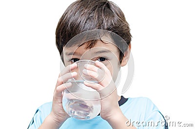 Little boy drinks water from a glass Stock Photo