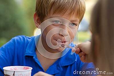 Little boy eating ice-cream Stock Photo