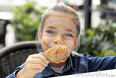 Little boy eats fried chicken Stock Photo