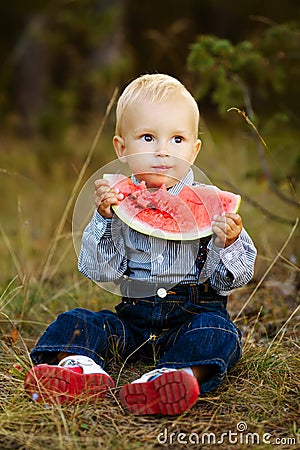Little boy eats watermelon Stock Photo