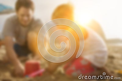 Little boy and father building sand castle at beach Stock Photo