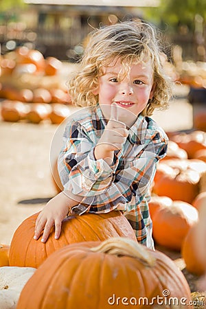 Little Boy Gives Thumbs Up at Pumpkin Patch Stock Photo