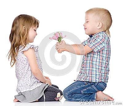 The little boy gives to the girl a flower. isolated on white Stock Photo