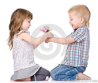 The little boy gives to the girl a flower. on white Stock Photo