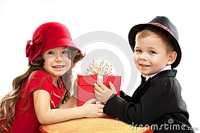 Little boy giving girl gift Stock Photo