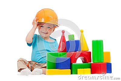 Little boy with hard hat and building blocks Stock Photo