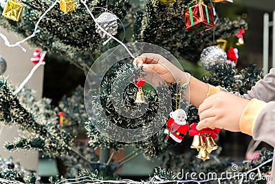 Little boy helping decorate Christmas tree Stock Photo