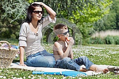 Little boy with his mom at picnic Stock Photo