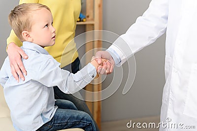 Little boy with his mother at paediatrician on consultation Stock Photo